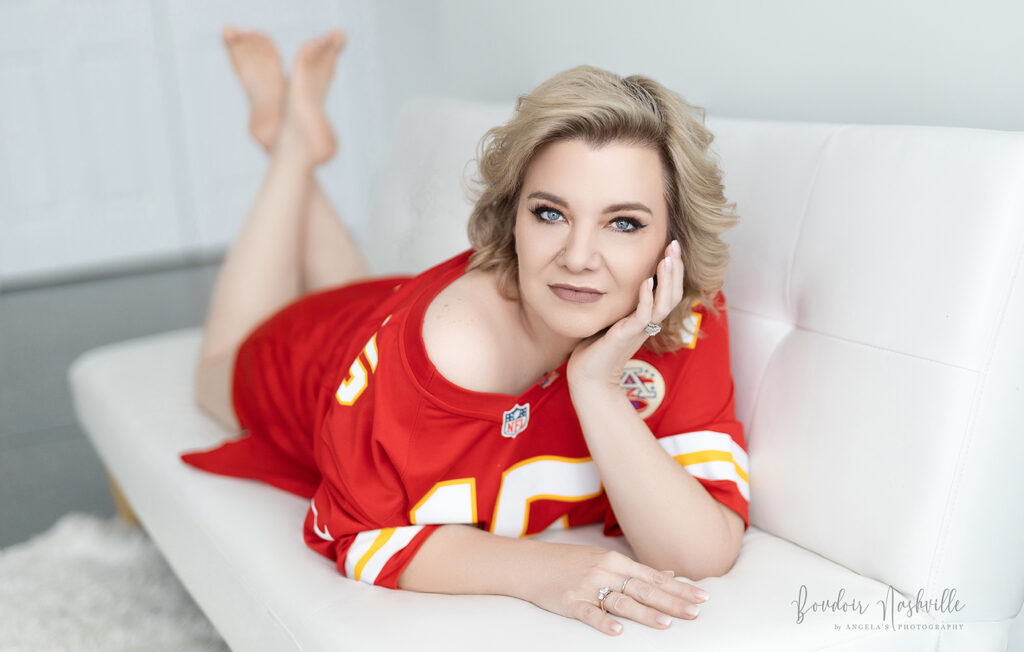 Boudoir Client in her husbands football jersey.